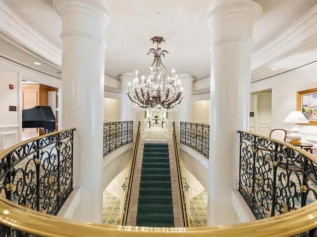 a front view of a house with a garden and patio