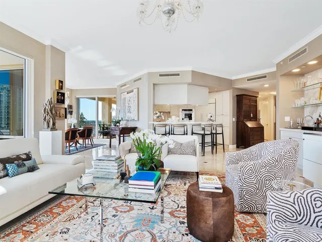 a kitchen with granite countertop white cabinets stainless steel appliances and sink