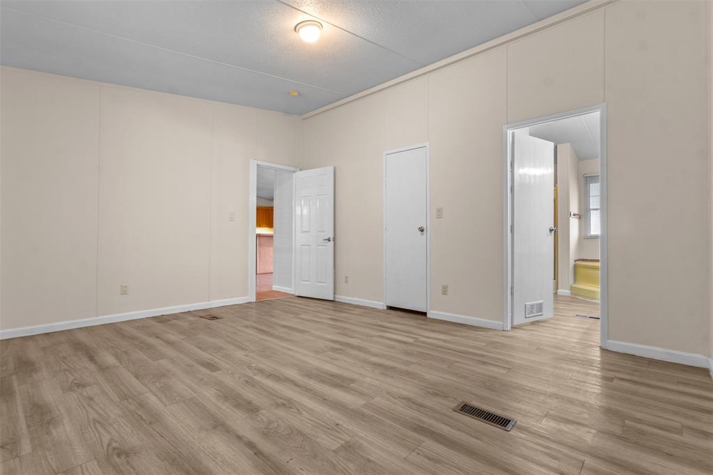 4000 Dee Drive Terrell, TX 75160 - Photo 11 of 21 a view of an empty room with wooden floor and closet