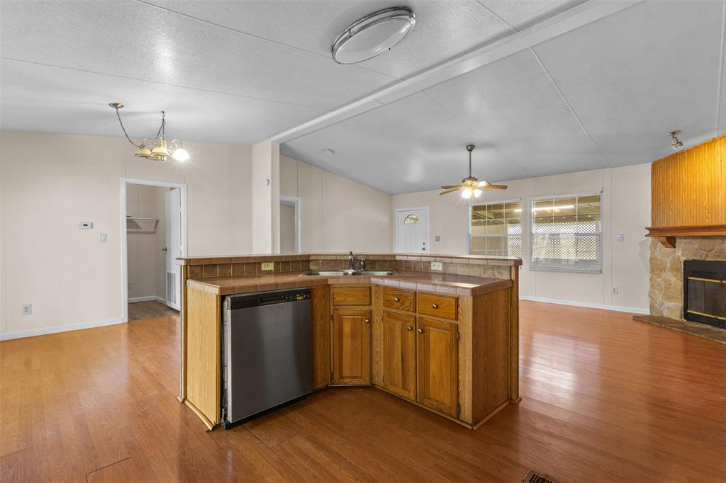 4000 Dee Drive Terrell, TX 75160 - Photo 8 of 21 a kitchen with a sink cabinets and wooden floor
