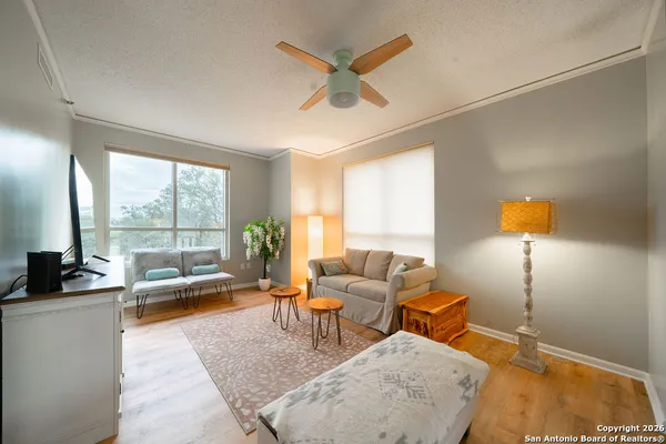 a living room with furniture and a large window