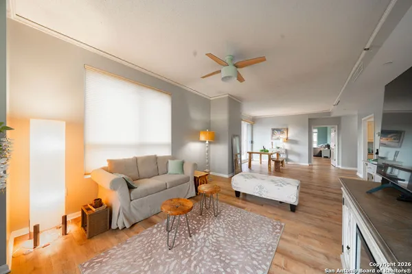 a living room with furniture and a large window