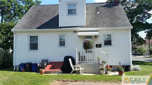 406 Fulton Street Middlesex, NJ 08846 - Photo 2 of 19 a front view of a house with garden