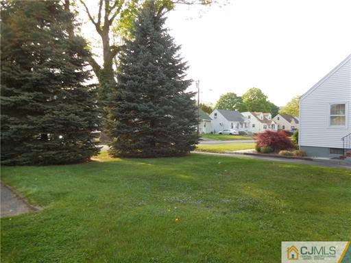 406 Fulton Street Middlesex, NJ 08846 - Photo 13 of 19 a view of yard with swimming pool and green space