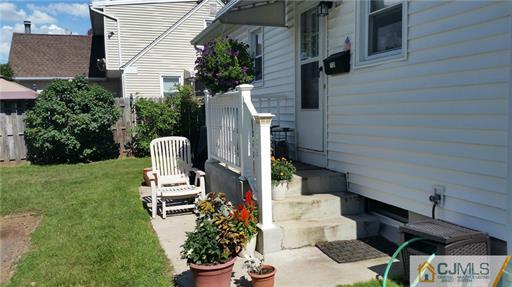 406 Fulton Street Middlesex, NJ 08846 - Photo 15 of 19 a view of backyard with outdoor seating and plants