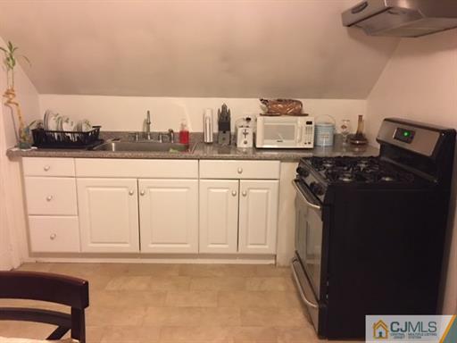 406 Fulton Street Middlesex, NJ 08846 - Photo 9 of 19 a kitchen with a sink and cabinets