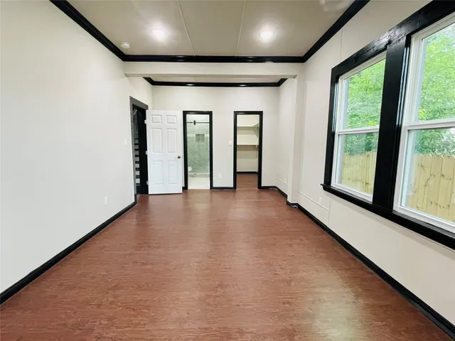 a view of an empty room with a window