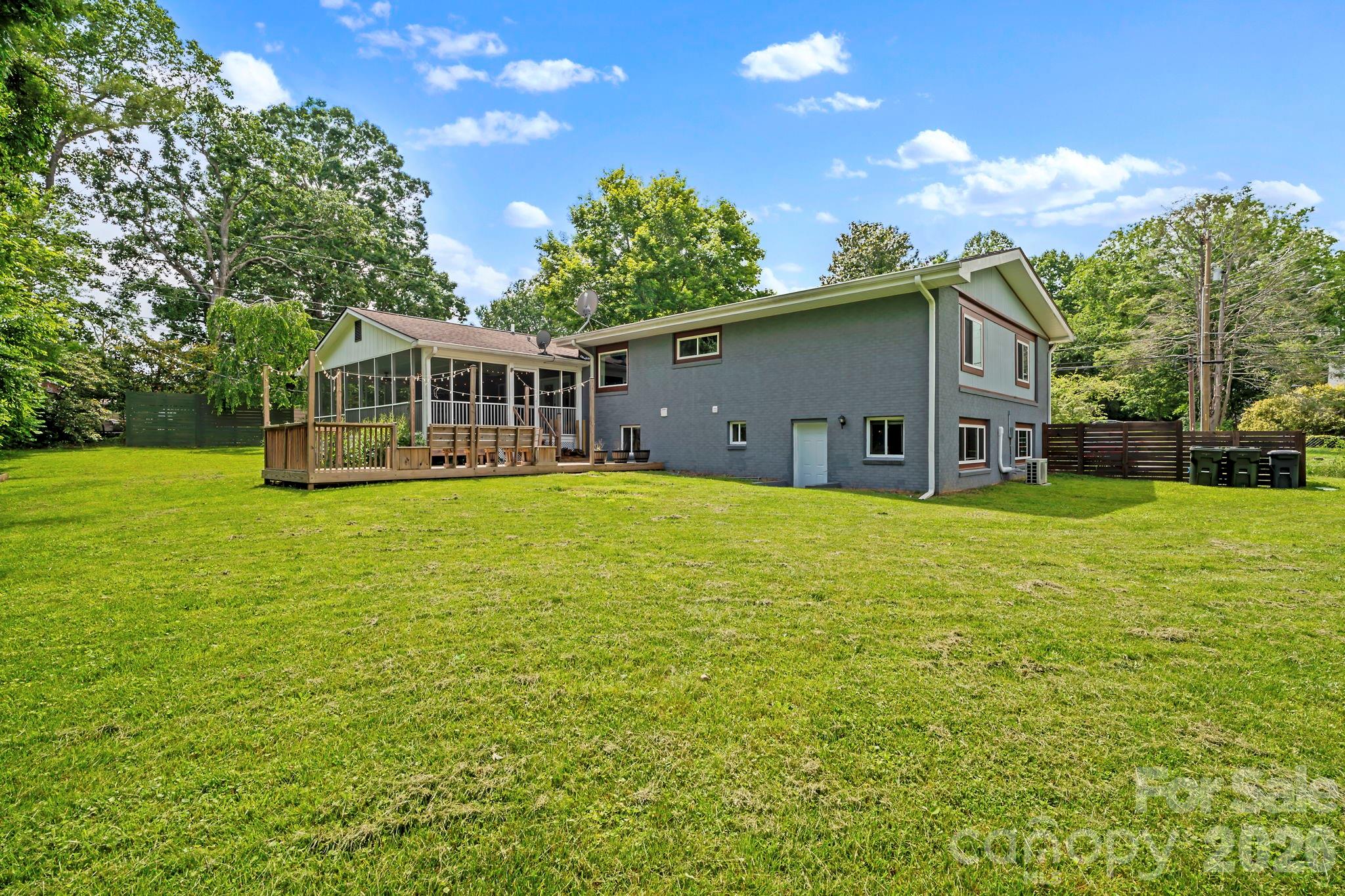 419 East Blue Ridge Road East Flat Rock, NC 28726 - Photo 2 of 44 a house view with a garden space