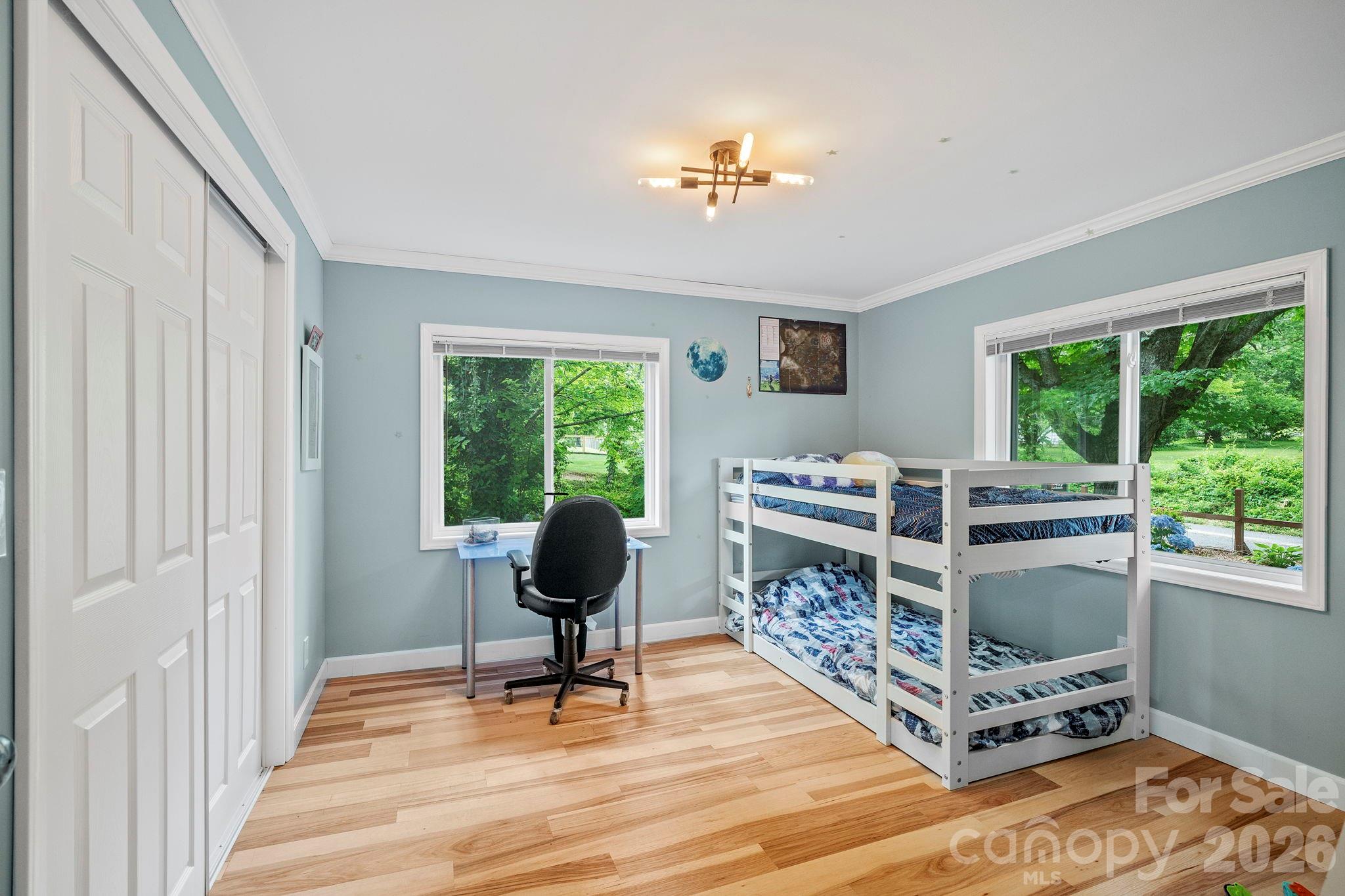419 East Blue Ridge Road East Flat Rock, NC 28726 - Photo 25 of 44 a living room with furniture and a floor to ceiling window