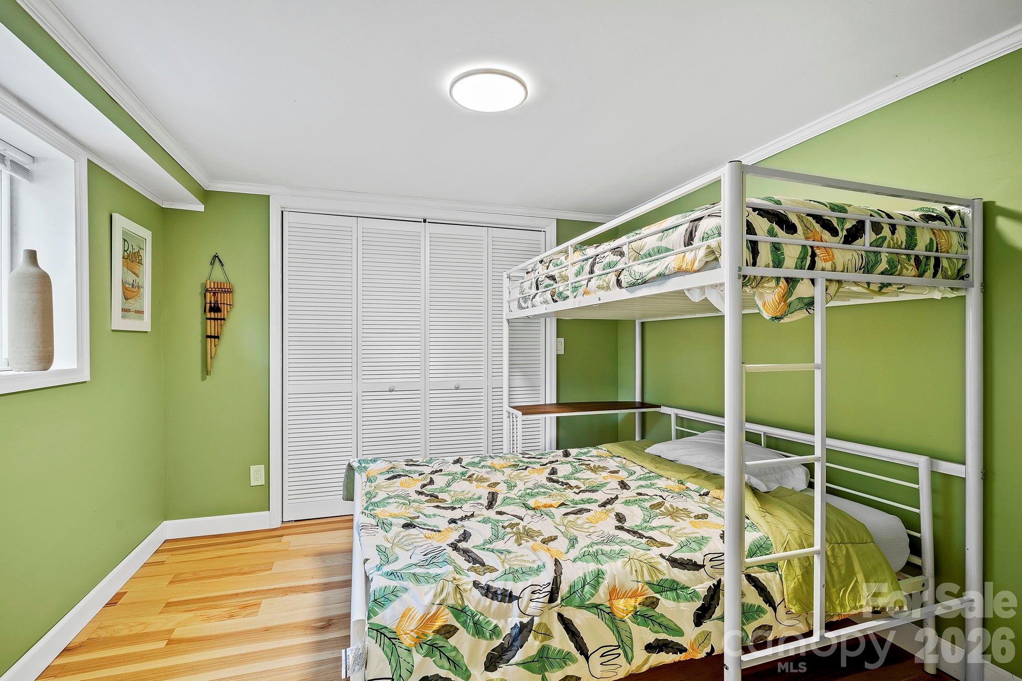 419 East Blue Ridge Road East Flat Rock, NC 28726 - Photo 33 of 44 a bedroom with a bed and a window