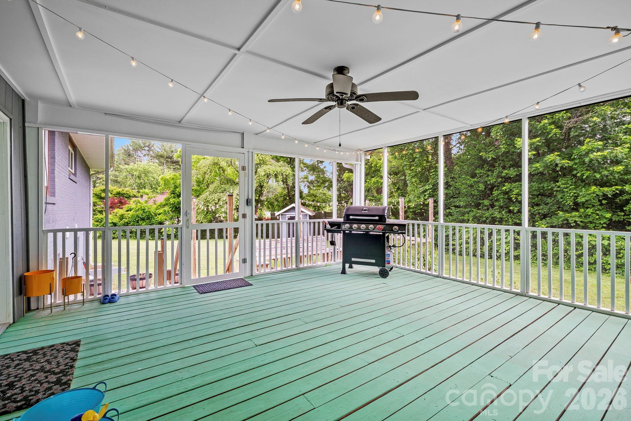 419 East Blue Ridge Road East Flat Rock, NC 28726 - Photo 35 of 44 a view of a porch with wooden floor