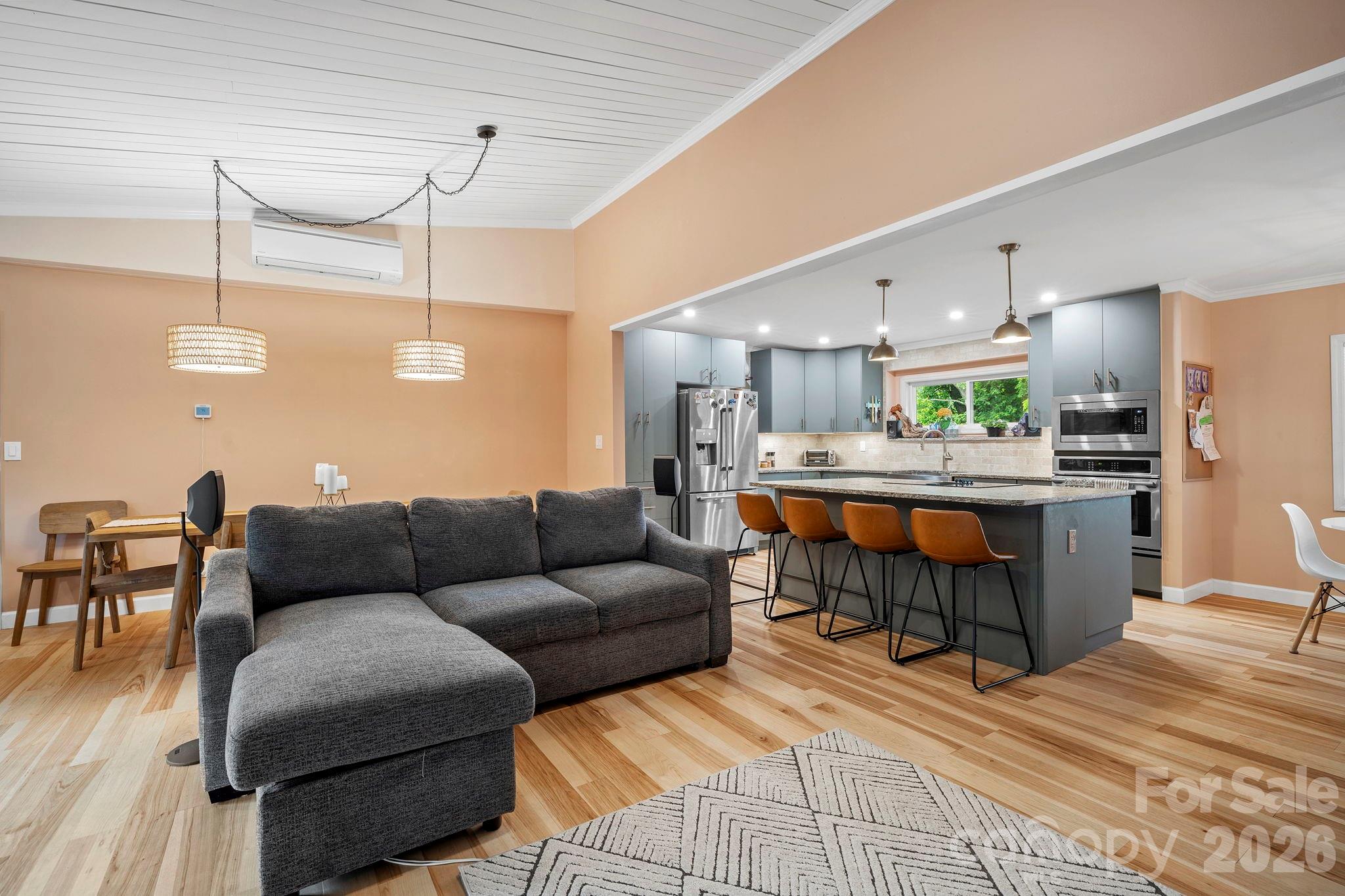 419 East Blue Ridge Road East Flat Rock, NC 28726 - Photo 8 of 44 a living room with furniture and kitchen view