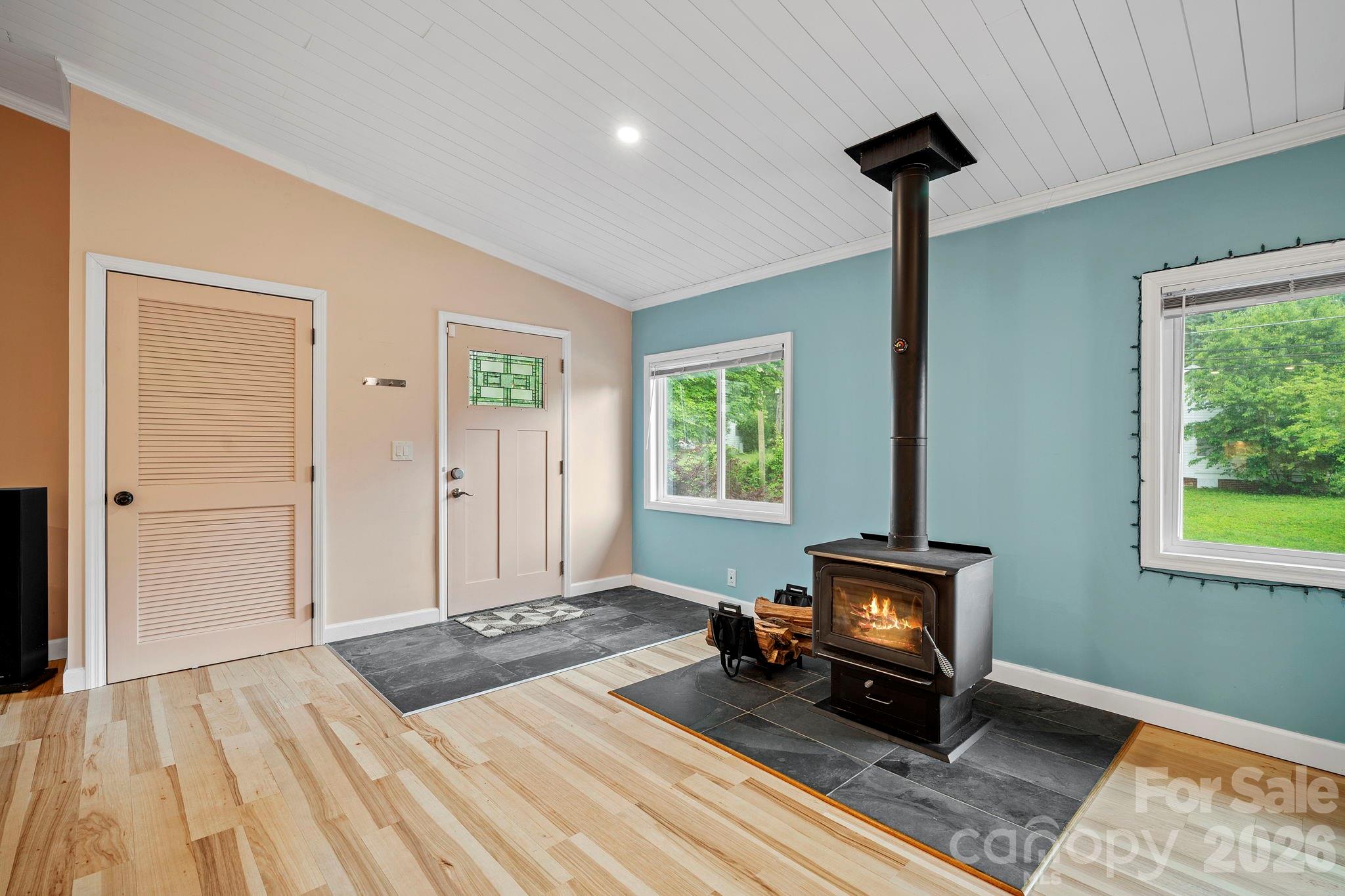 419 East Blue Ridge Road East Flat Rock, NC 28726 - Photo 10 of 44 a bedroom with a bed and a window