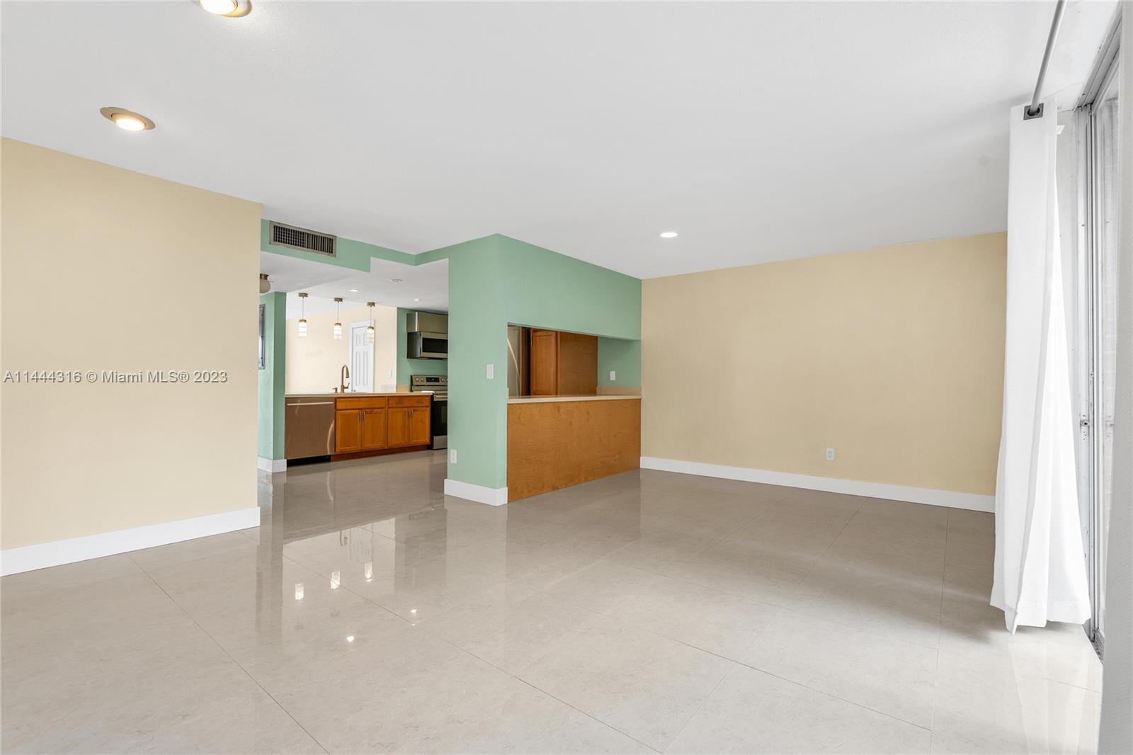 14001 Southwest 84th Street, Unit 1308 Miami, FL 33183 - Photo 12 of 47 a view of kitchen and utility room