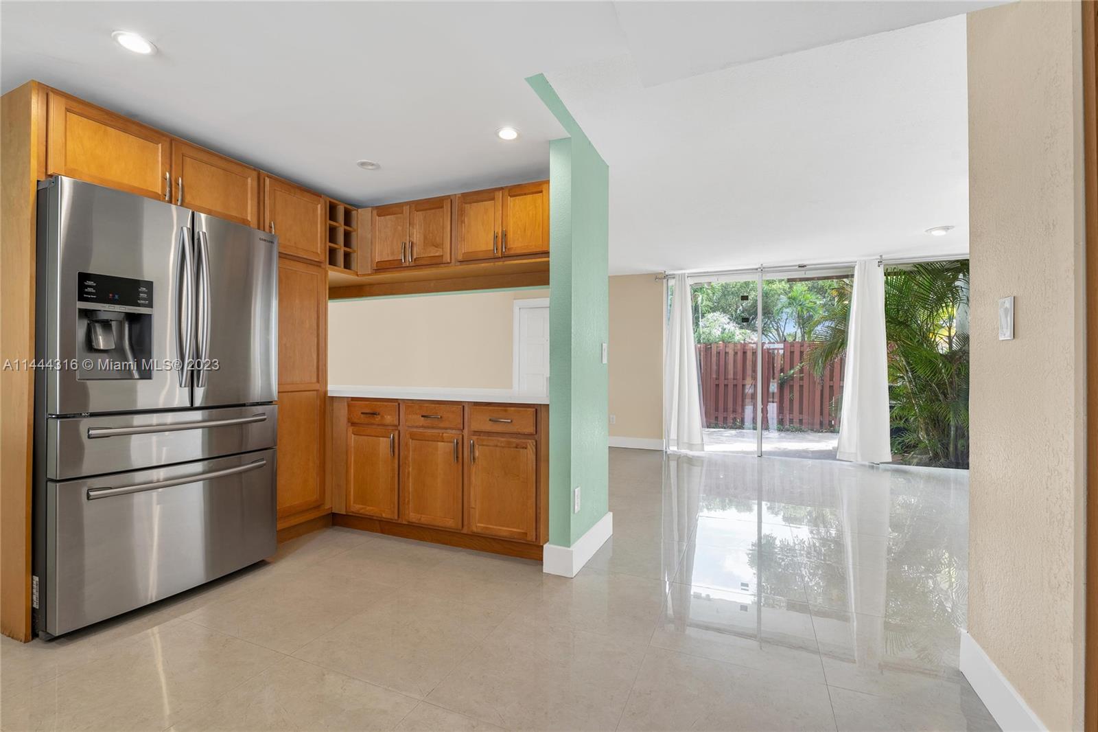 14001 Southwest 84th Street, Unit 1308 Miami, FL 33183 - Photo 15 of 47 a kitchen with stainless steel appliances granite countertop a refrigerator and a sink