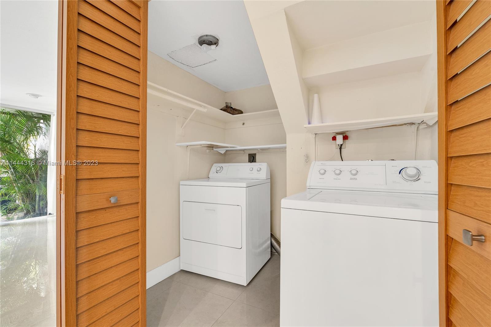 14001 Southwest 84th Street, Unit 1308 Miami, FL 33183 - Photo 19 of 47 a utility room with dryer and washer