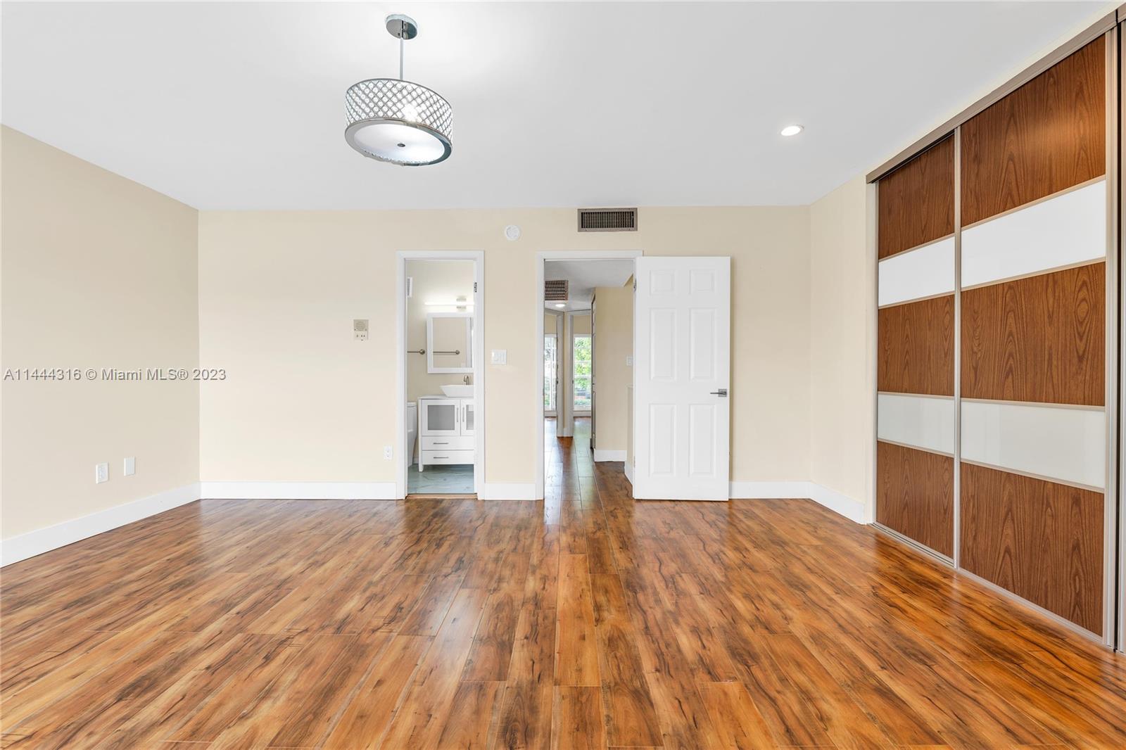 14001 Southwest 84th Street, Unit 1308 Miami, FL 33183 - Photo 27 of 47 a view of empty room with wooden floor