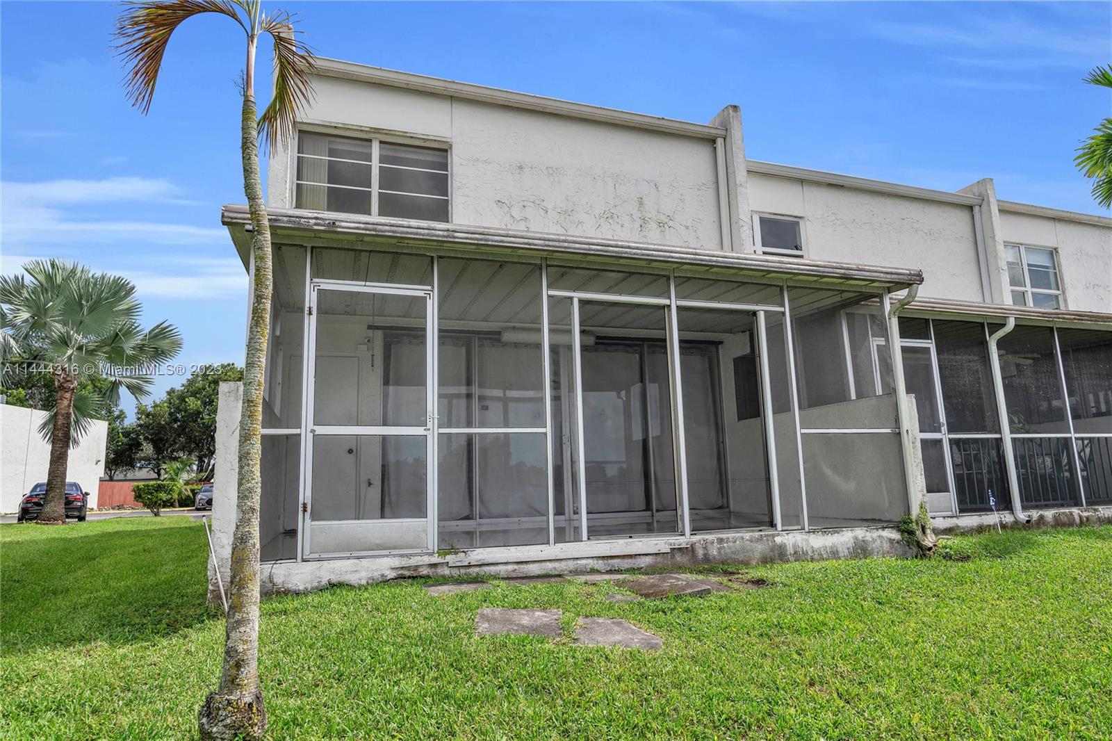 14001 Southwest 84th Street, Unit 1308 Miami, FL 33183 - Photo 32 of 47 front view of a house with a yard