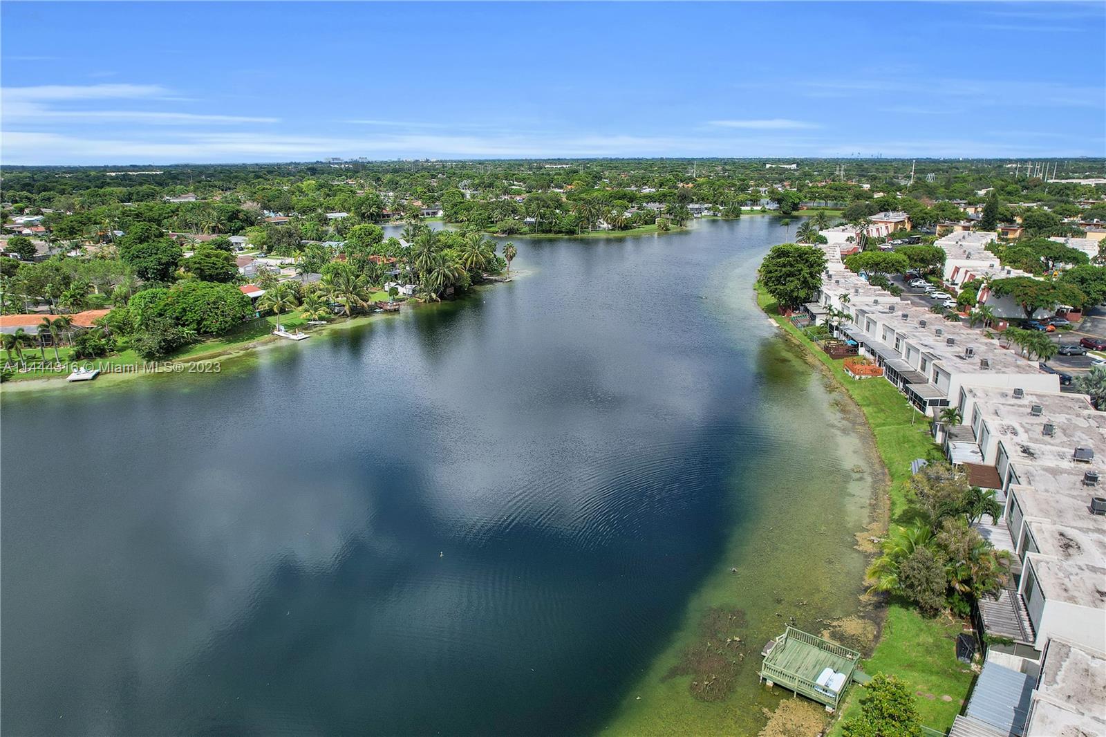 14001 Southwest 84th Street, Unit 1308 Miami, FL 33183 - Photo 44 of 47 a view of a lake with a city