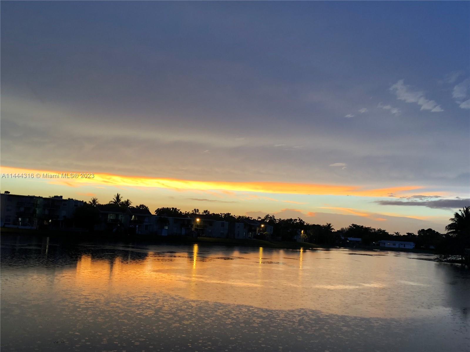 14001 Southwest 84th Street, Unit 1308 Miami, FL 33183 - Photo 45 of 47 a view of lake and sunset