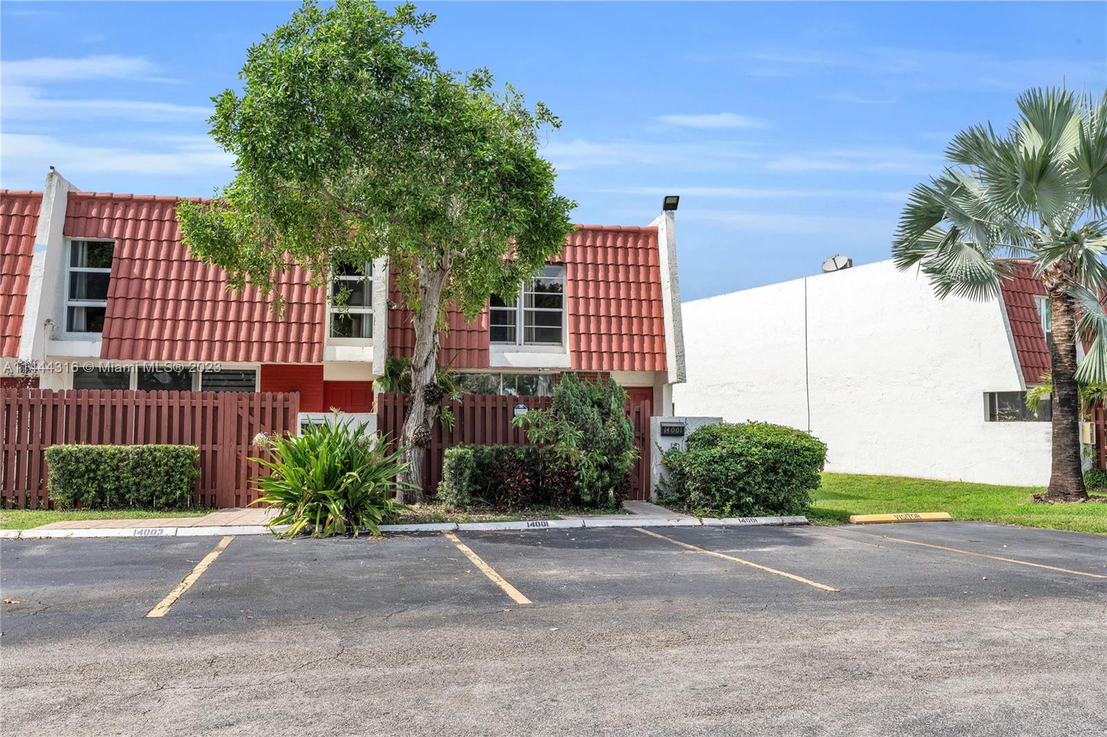 14001 Southwest 84th Street, Unit 1308 Miami, FL 33183 - Photo 5 of 47 a front view of a house having yard