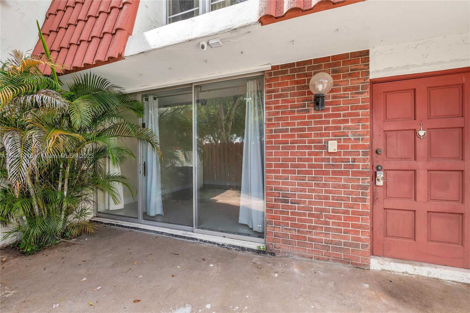 14001 Southwest 84th Street, Unit 1308 Miami, FL 33183 - Photo 6 of 47 a brick building with a window and a door