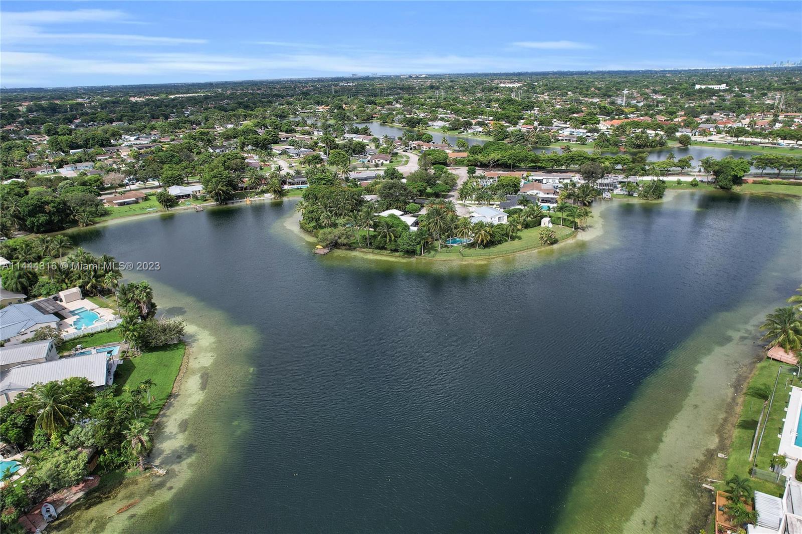 14001 Southwest 84th Street, Unit 1308 Miami, FL 33183 - Photo 8 of 47 an aerial view of residential houses with outdoor space and lake view
