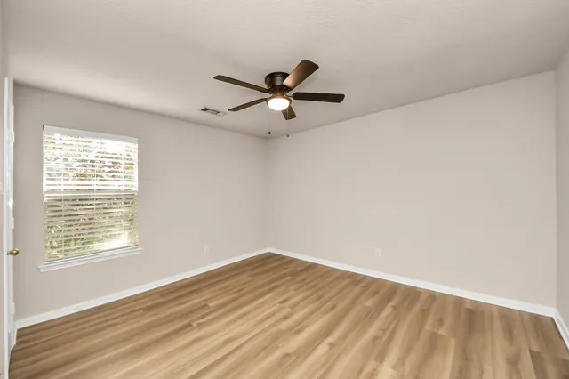 a bathroom with a double vanity sink and mirror