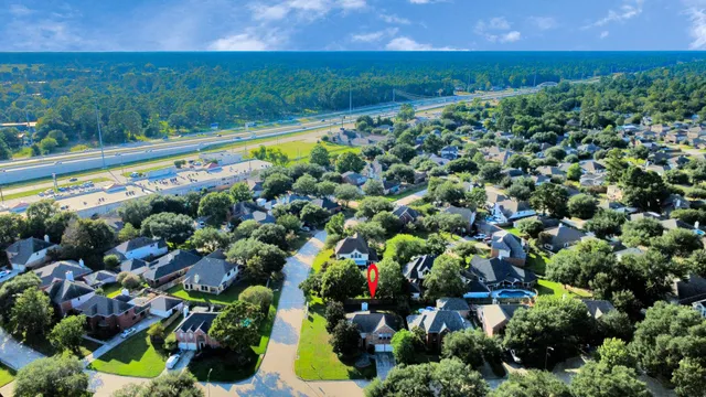 an aerial view of a house with yard swimming pool and outdoor seating