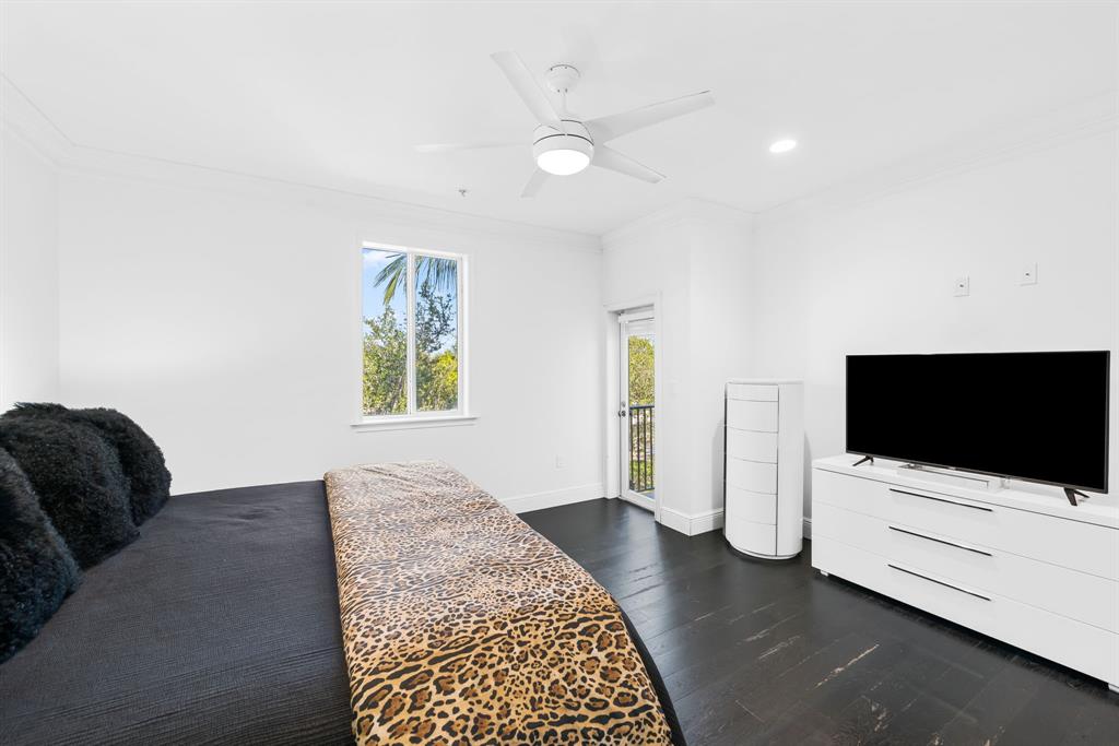 456 East Boca Raton Road Boca Raton, FL 33432 - Photo 17 of 24 a bedroom with furniture and flat screen tv