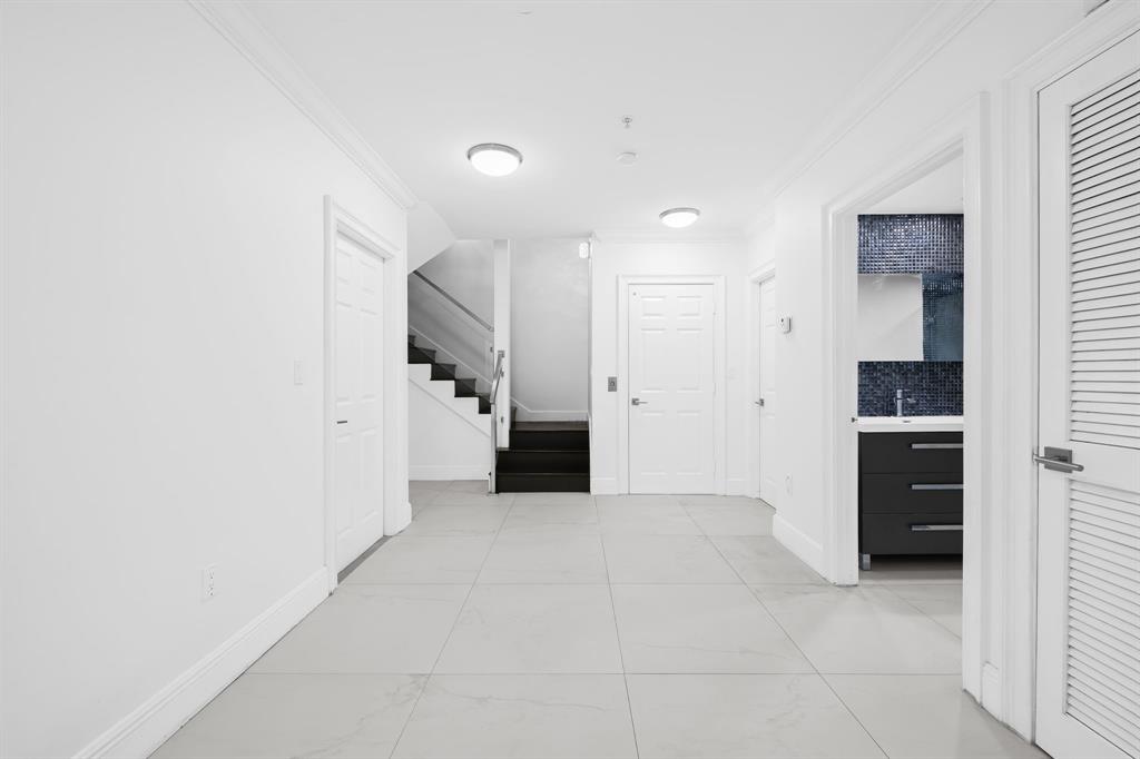 456 East Boca Raton Road Boca Raton, FL 33432 - Photo 5 of 24 a view of a kitchen with a refrigerator and a stove top oven
