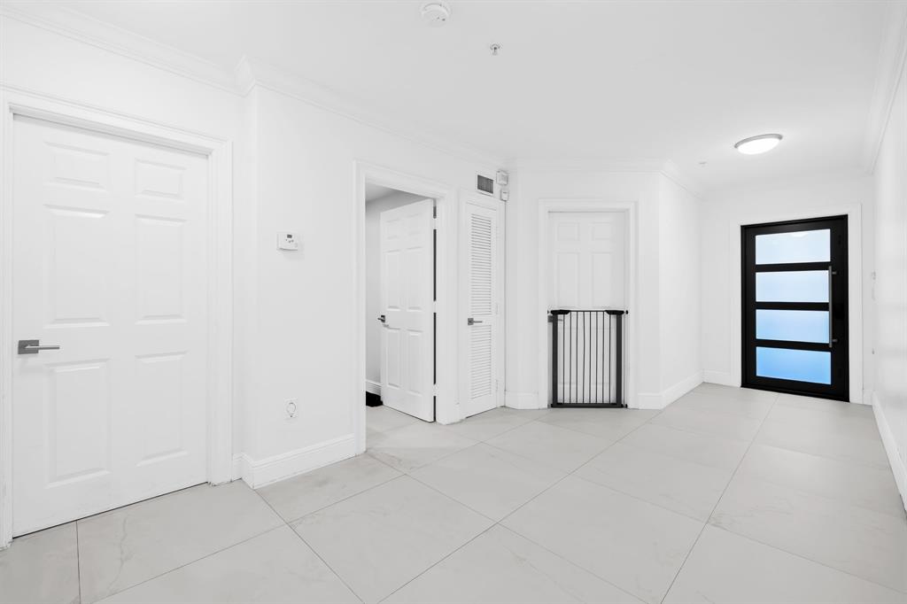 456 East Boca Raton Road Boca Raton, FL 33432 - Photo 6 of 24 an empty room with windows and closet