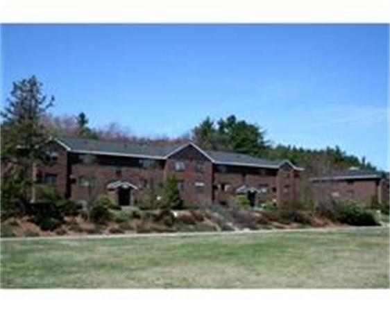 50 Spencer Road, Unit 24L Boxborough, MA 01719 - Photo 1 of 14 a front view of a house with a garden