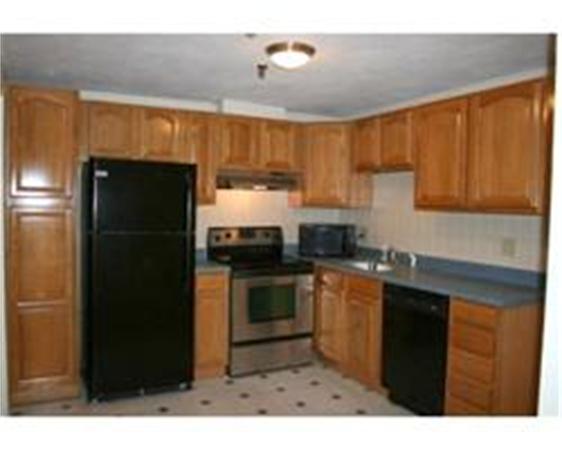 50 Spencer Road, Unit 24L Boxborough, MA 01719 - Photo 4 of 14 a kitchen with stainless steel appliances granite countertop a refrigerator a sink dishwasher with a stove and cabinets