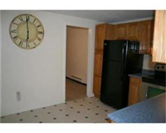 50 Spencer Road, Unit 24L Boxborough, MA 01719 - Photo 5 of 14 a picture of a kitchen with a refrigerator and a stove