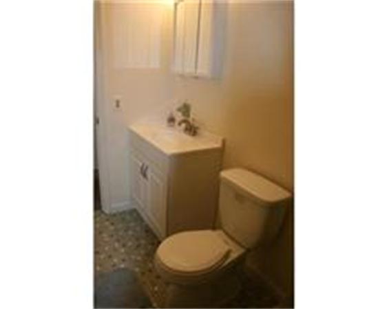 50 Spencer Road, Unit 24L Boxborough, MA 01719 - Photo 8 of 14 a bathroom with a toilet and a sink