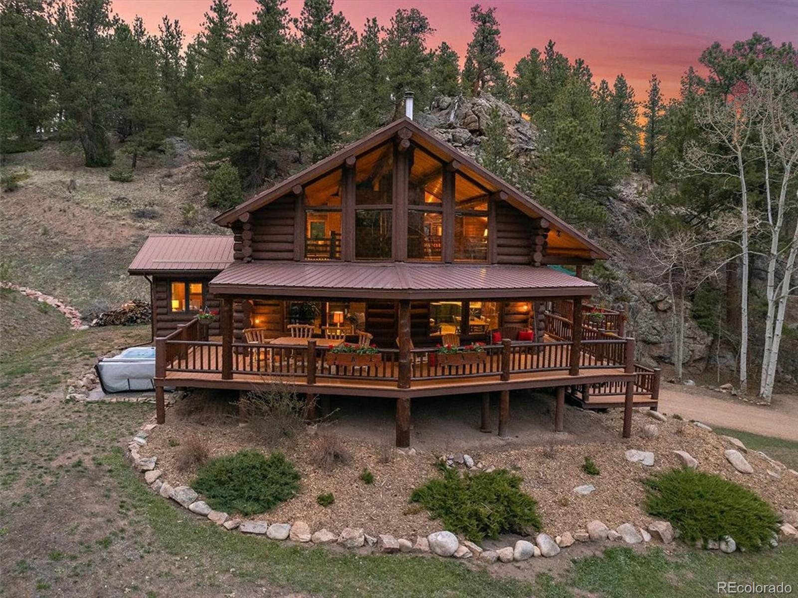 3602 Riverside Drive Lyons, CO 80540 - Photo 1 of 40 a view of a house with a yard and sitting area