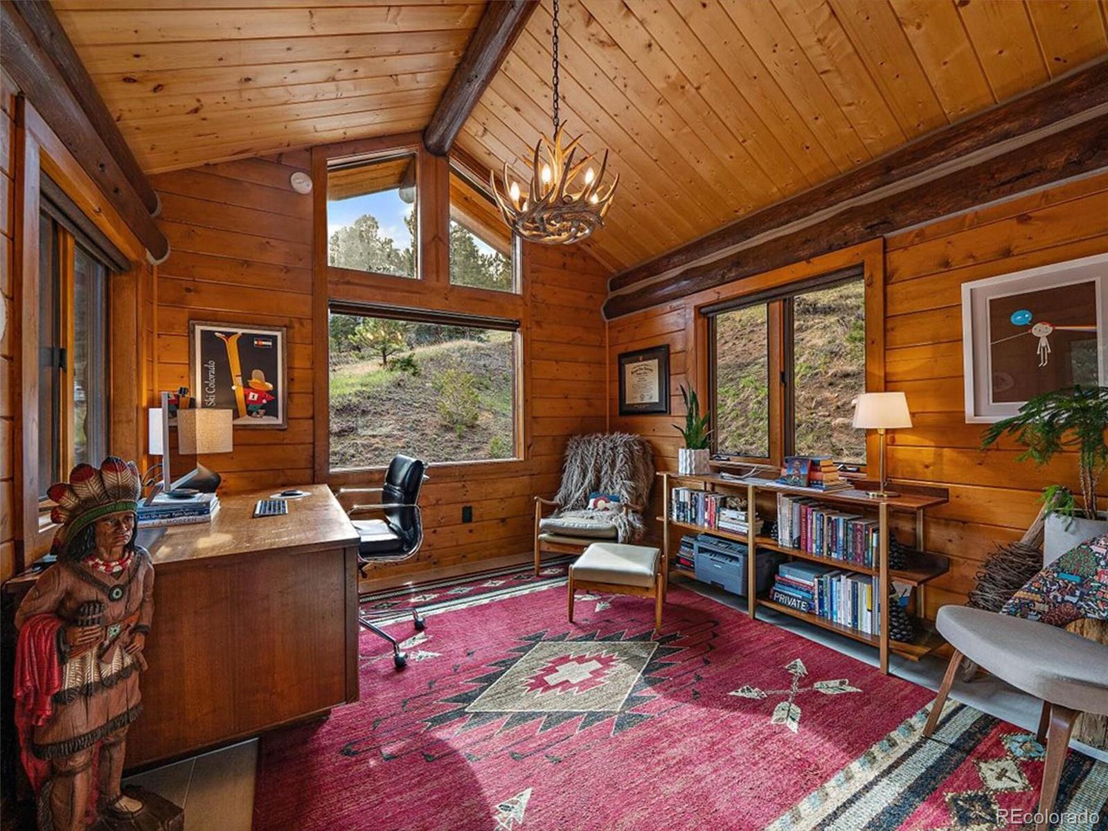 3602 Riverside Drive Lyons, CO 80540 - Photo 18 of 40 a living room with furniture a rug and a large window