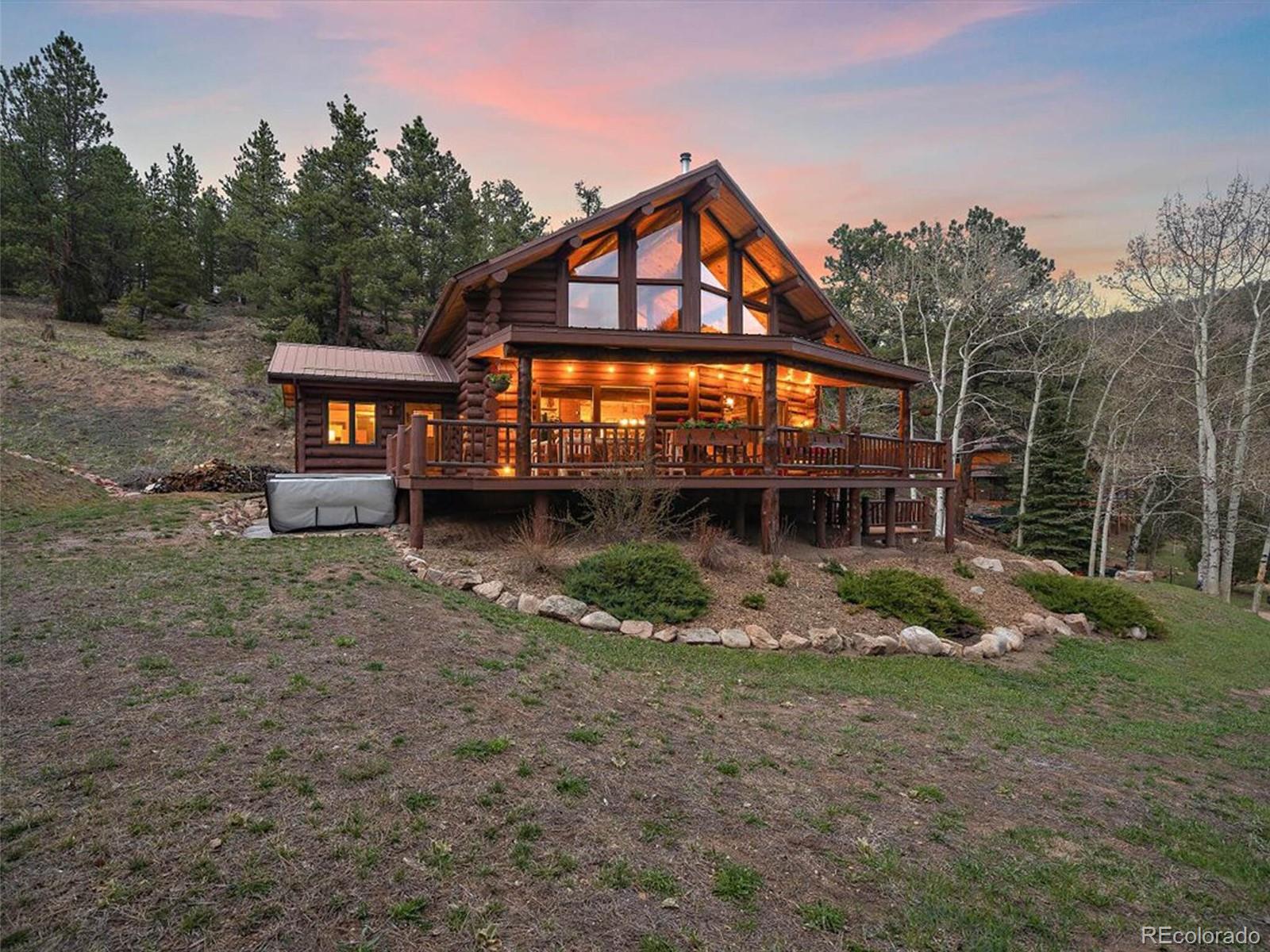 3602 Riverside Drive Lyons, CO 80540 - Photo 33 of 40 a front view of a house with garden