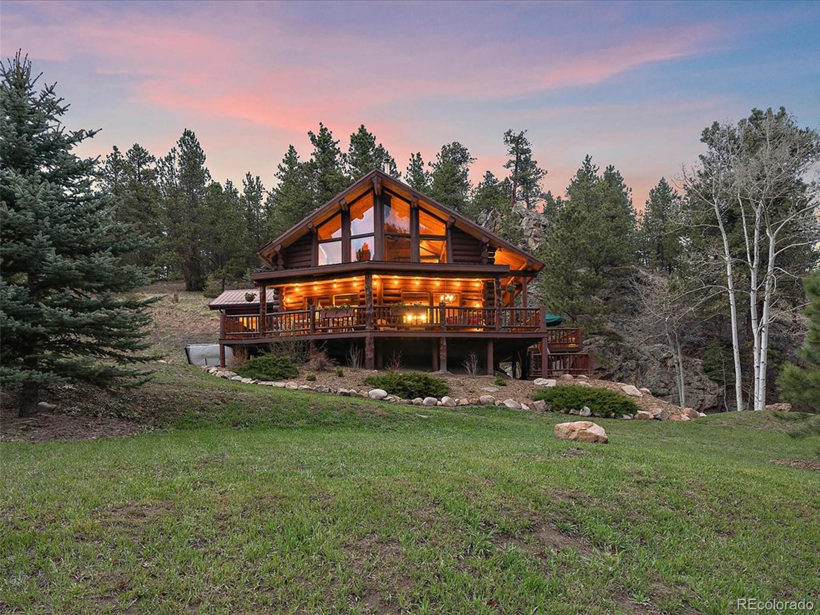 3602 Riverside Drive Lyons, CO 80540 - Photo 36 of 40 a front view of a house with garden