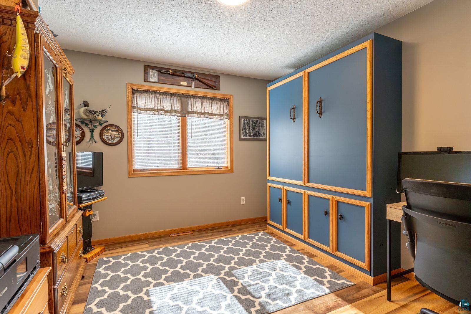 4452 Moccasin Point Road Tower, MN 55790 - Photo 19 of 44 Light wood-finish flooring with a neutral wall color