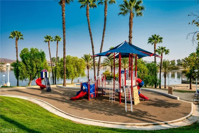 a view of a park with swings and slides