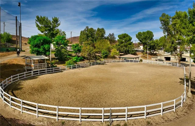 a view of a swimming pool with a lawn chairs and a lawn chairs