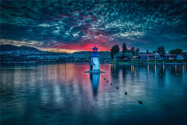a view of a lake with houses in the back