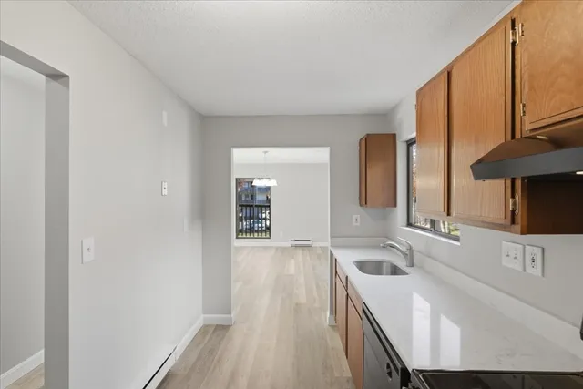 a kitchen with a refrigerator and a sink
