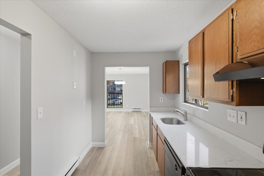 800 Bearses Way, Unit 2SB Barnstable, MA 02601 - Photo 18 of 40 a bathroom with a sink a mirror and a bathtub