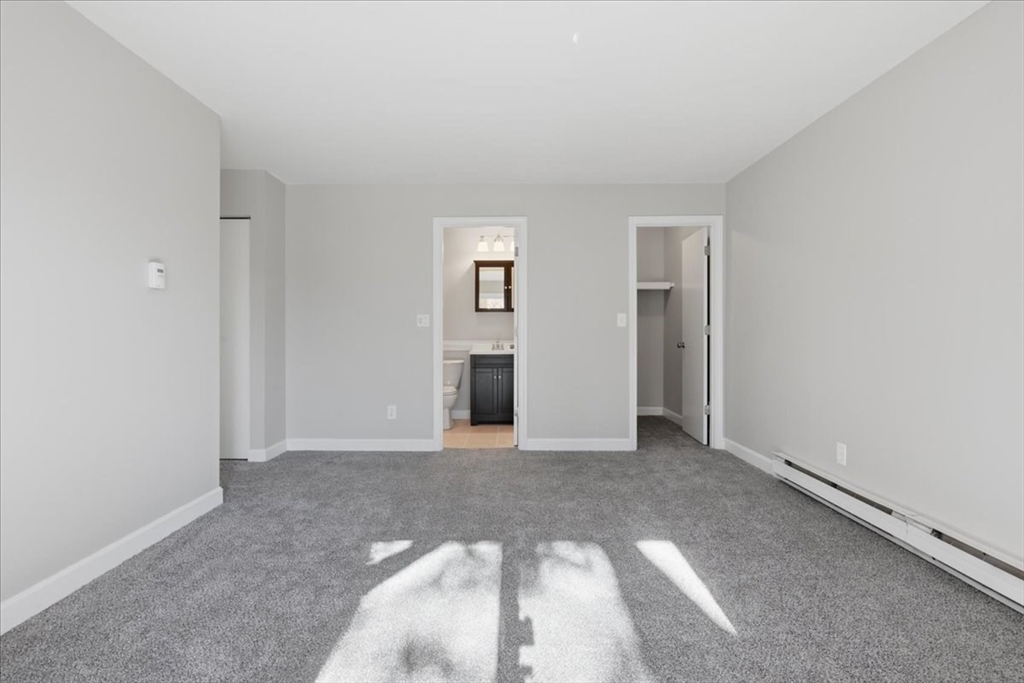 800 Bearses Way, Unit 2SB Barnstable, MA 02601 - Photo 22 of 40 an empty room with closet and natural light