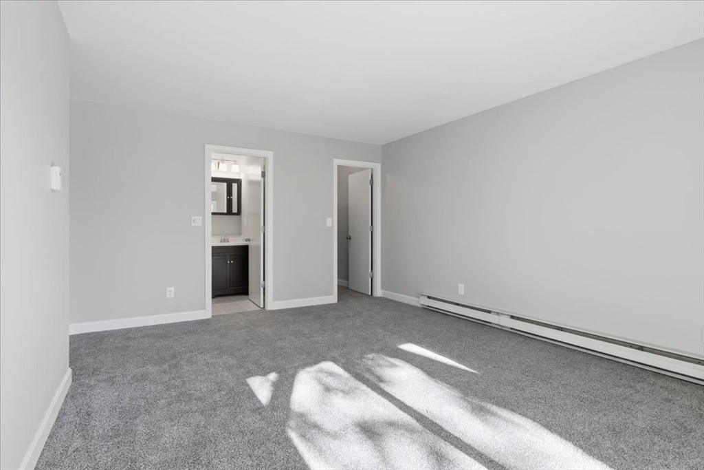 800 Bearses Way, Unit 2SB Barnstable, MA 02601 - Photo 24 of 40 a view of an empty room with closet and a window