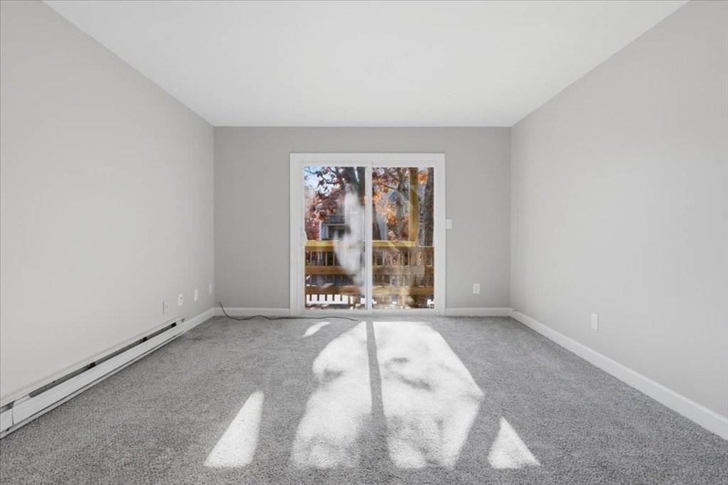 800 Bearses Way, Unit 2SB Barnstable, MA 02601 - Photo 25 of 40 a view of an empty room with a window