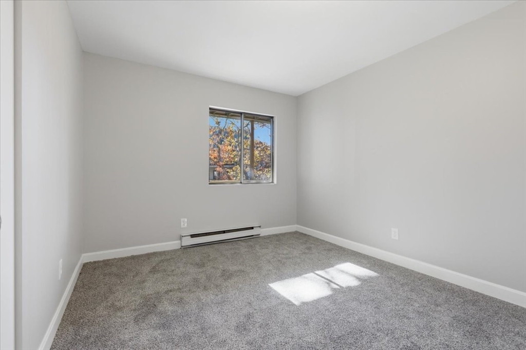 800 Bearses Way, Unit 2SB Barnstable, MA 02601 - Photo 30 of 40 an empty room with a empty space and window